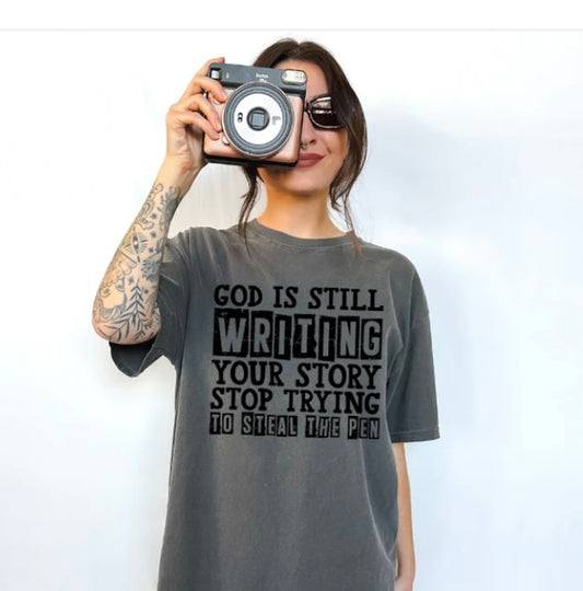 God is still writing your story tee